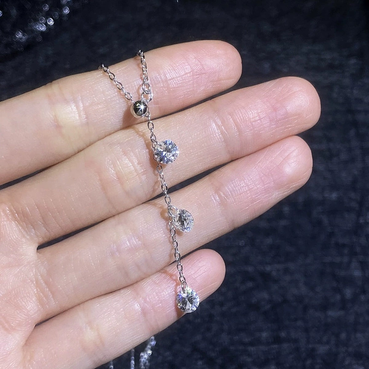 Triple Moissanite Drop Necklace in Platinum-Plated S925 Sterling Silver close-up product detail view