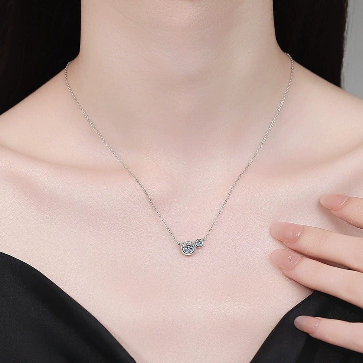 Two-Stone Moissanite Bypass Necklace in Platinum-Plated S925 Sterling Silver worn on neckline by model
