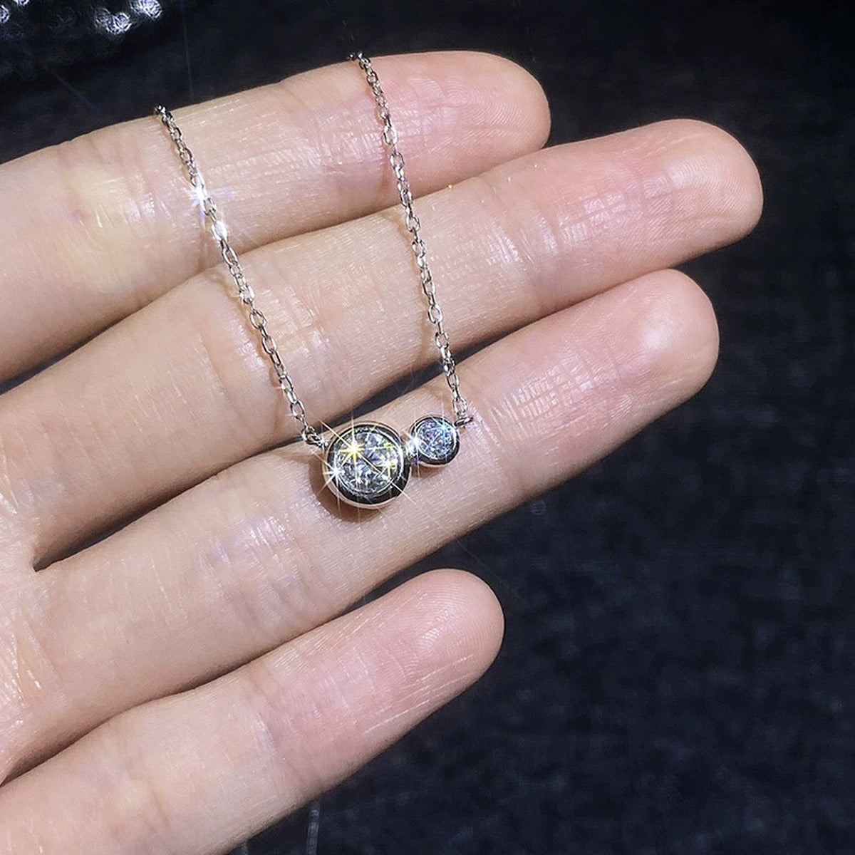 Two-Stone Moissanite Bypass Necklace in Platinum-Plated S925 Sterling Silver close-up product detail view