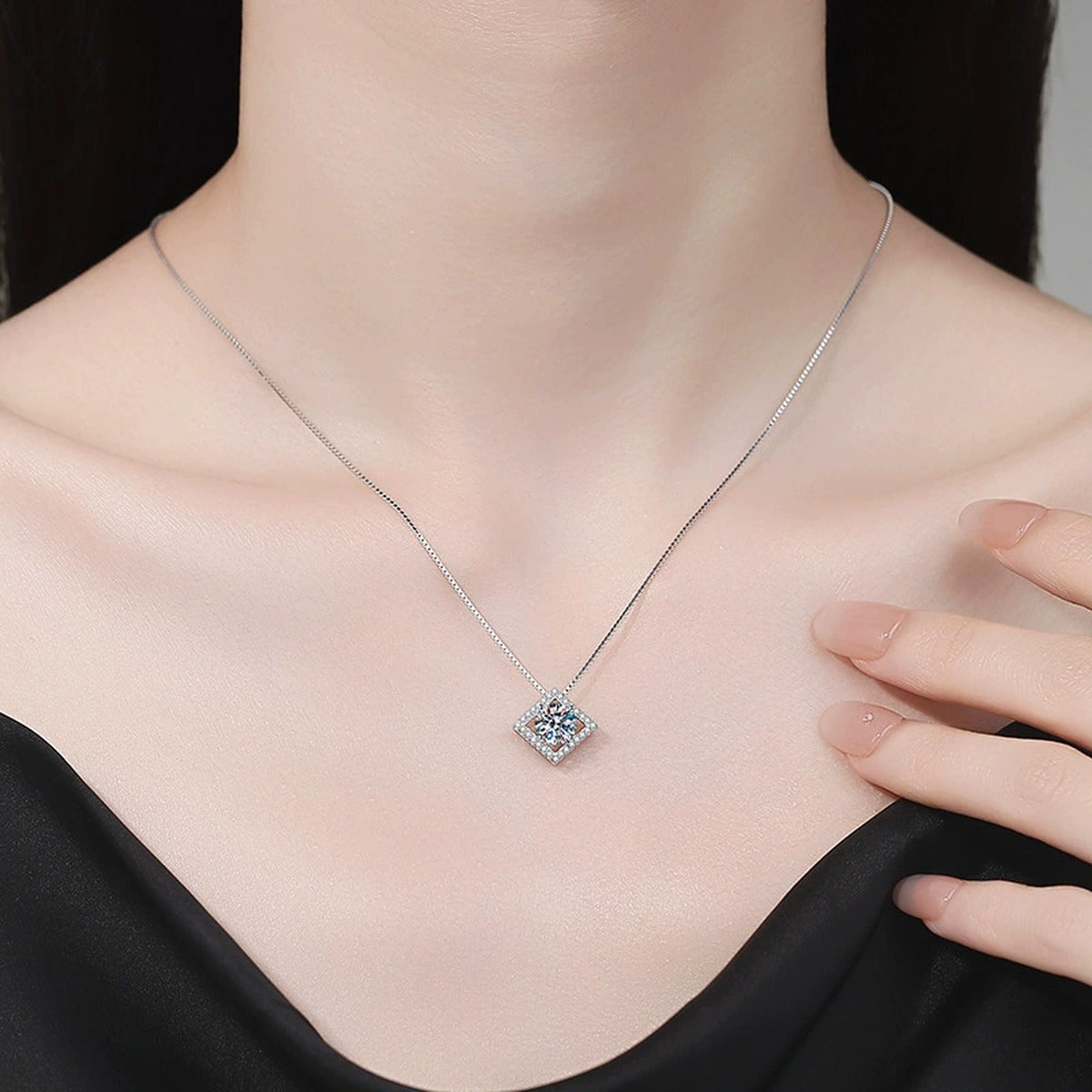 Diamond Halo Moissanite Pendant Necklace with Cubic Zirconia in Platinum-Plated S925 Sterling Silver worn on neckline by model