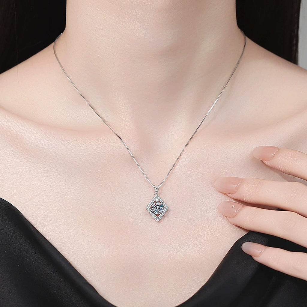 Rhombus Halo Moissanite Pendant Necklace with Cubic Zirconia in Platinum-Plated S925 Sterling Silver worn on neckline by model