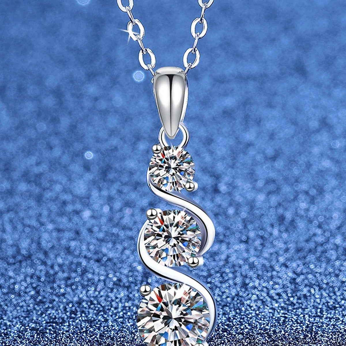 Three-Stone Graduated Moissanite Pendant Necklace in Platinum-Plated S925 Sterling Silver blue background product view
