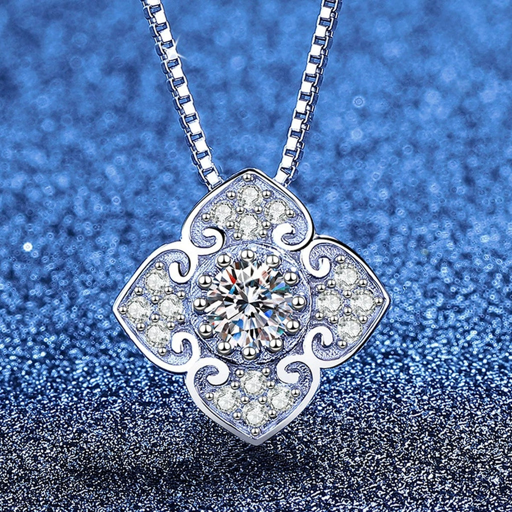Quatrefoil Clover Moissanite Pendant Necklace with Cubic Zirconia in Platinum-Plated S925 Sterling Silver blue background product view