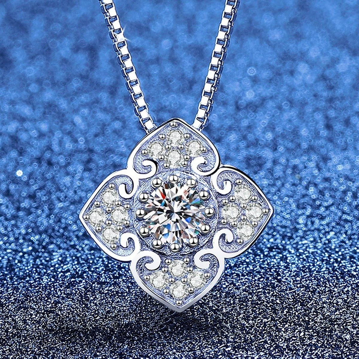 Quatrefoil Clover Moissanite Pendant Necklace with Cubic Zirconia in Platinum-Plated S925 Sterling Silver blue background product view
