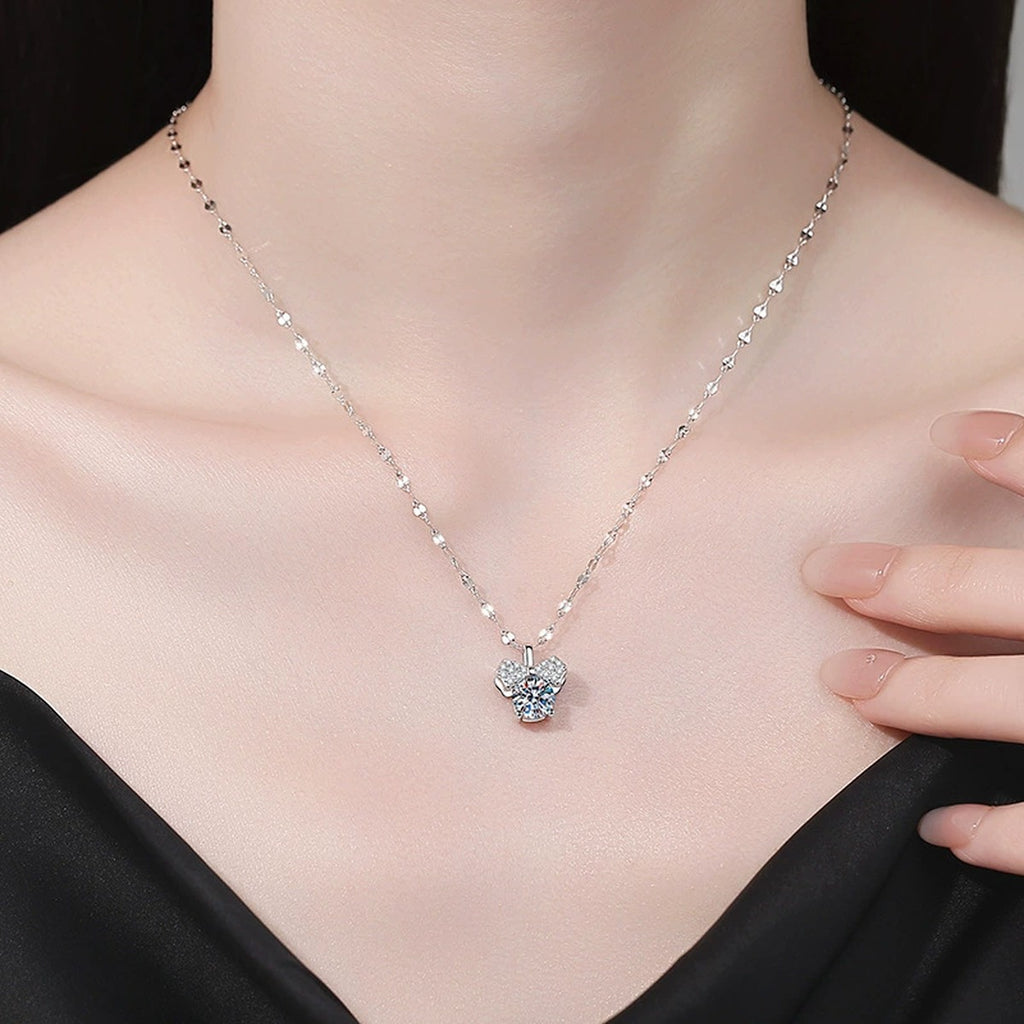 Bow Moissanite Pendant Necklace with Cubic Zirconia in Platinum-Plated S925 Sterling Silver worn on neckline by model
