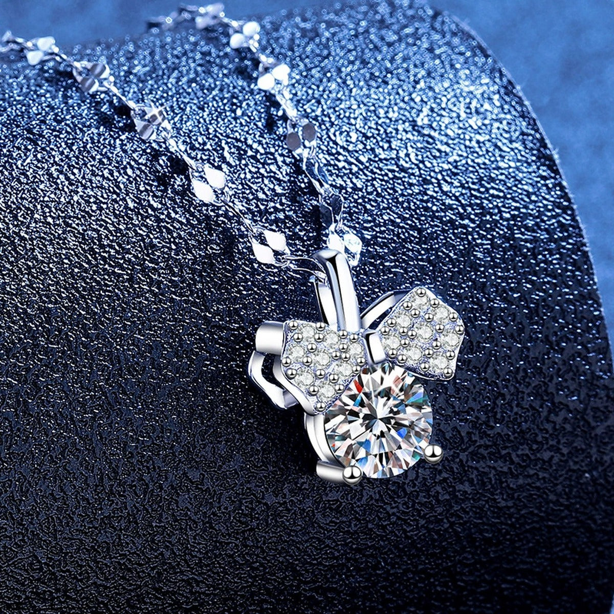 Bow Moissanite Pendant Necklace with Cubic Zirconia in Platinum-Plated S925 Sterling Silver blue background product view