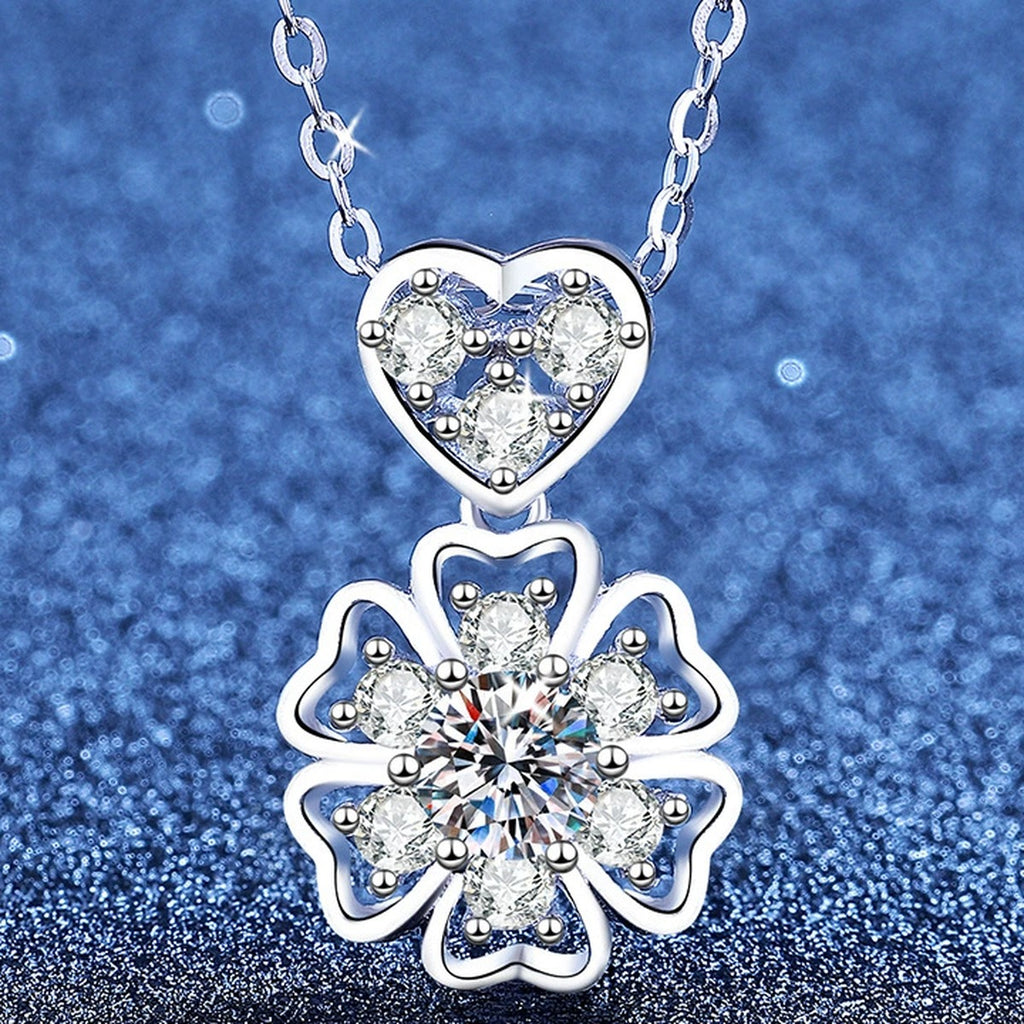 Floral Heart Moissanite Pendant Necklace with Cubic Zirconia in Platinum-Plated S925 Sterling Silver blue background angled view