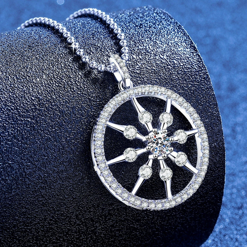 Wheel Circle Moissanite Pendant Necklace with Cubic Zirconia in Platinum-Plated S925 Sterling Silver blue background angled view