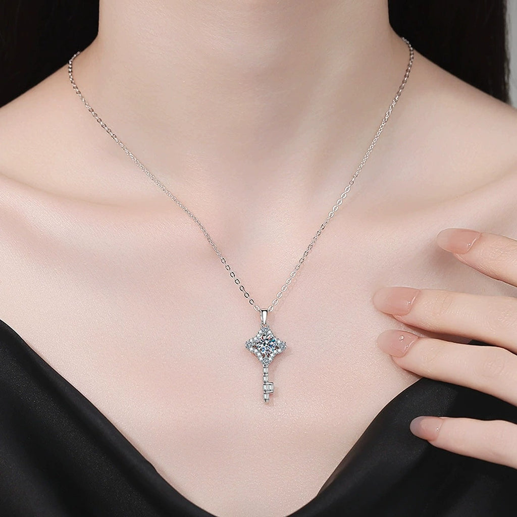 Ornate Key Moissanite Pendant Necklace with Cubic Zirconia in Platinum-Plated S925 Sterling Silver worn on neckline by model