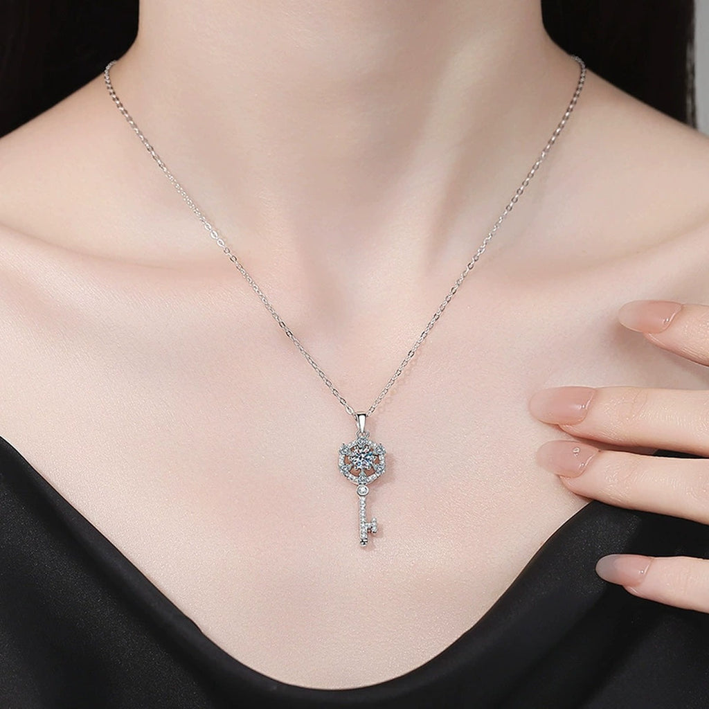 Round Halo Key Moissanite Pendant Necklace with Cubic Zirconia in Platinum-Plated S925 Sterling Silver worn on neckline by model