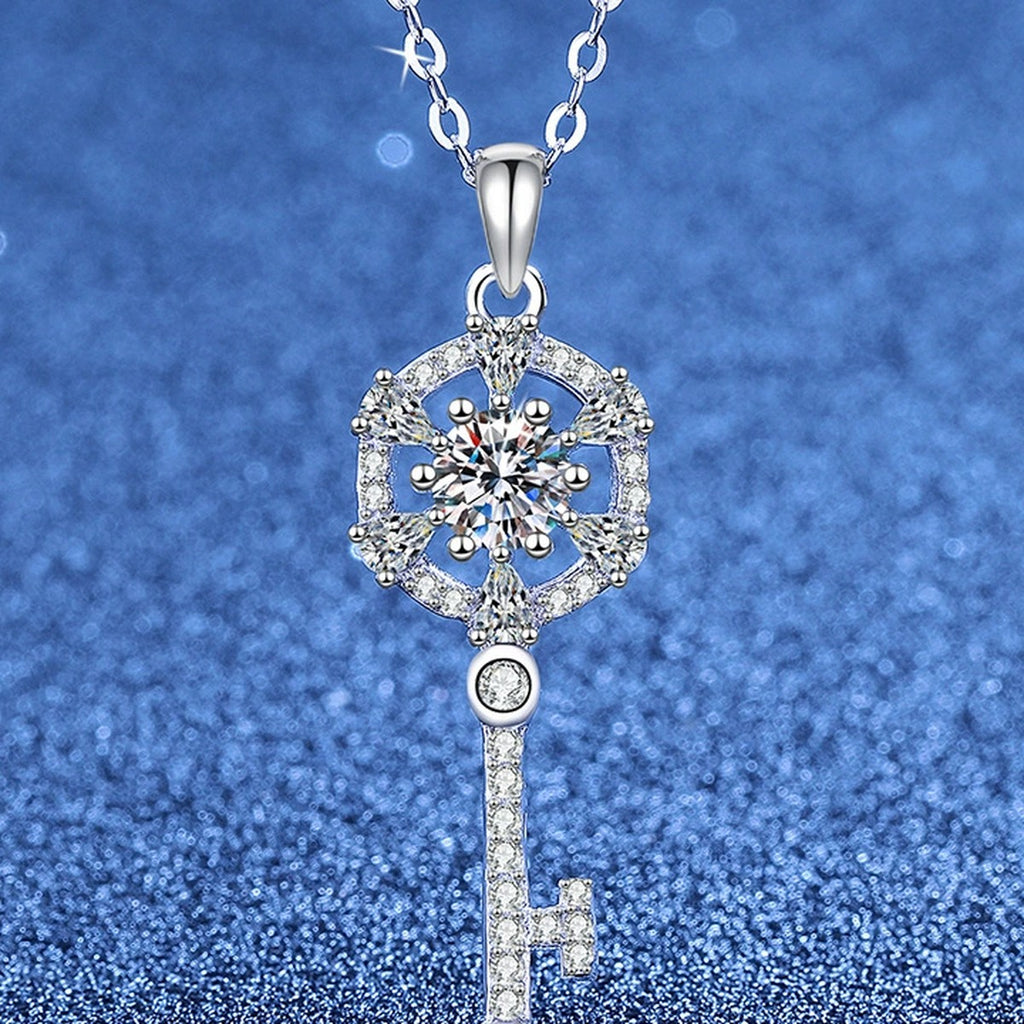 Round Halo Key Moissanite Pendant Necklace with Cubic Zirconia in Platinum-Plated S925 Sterling Silver blue background angled view