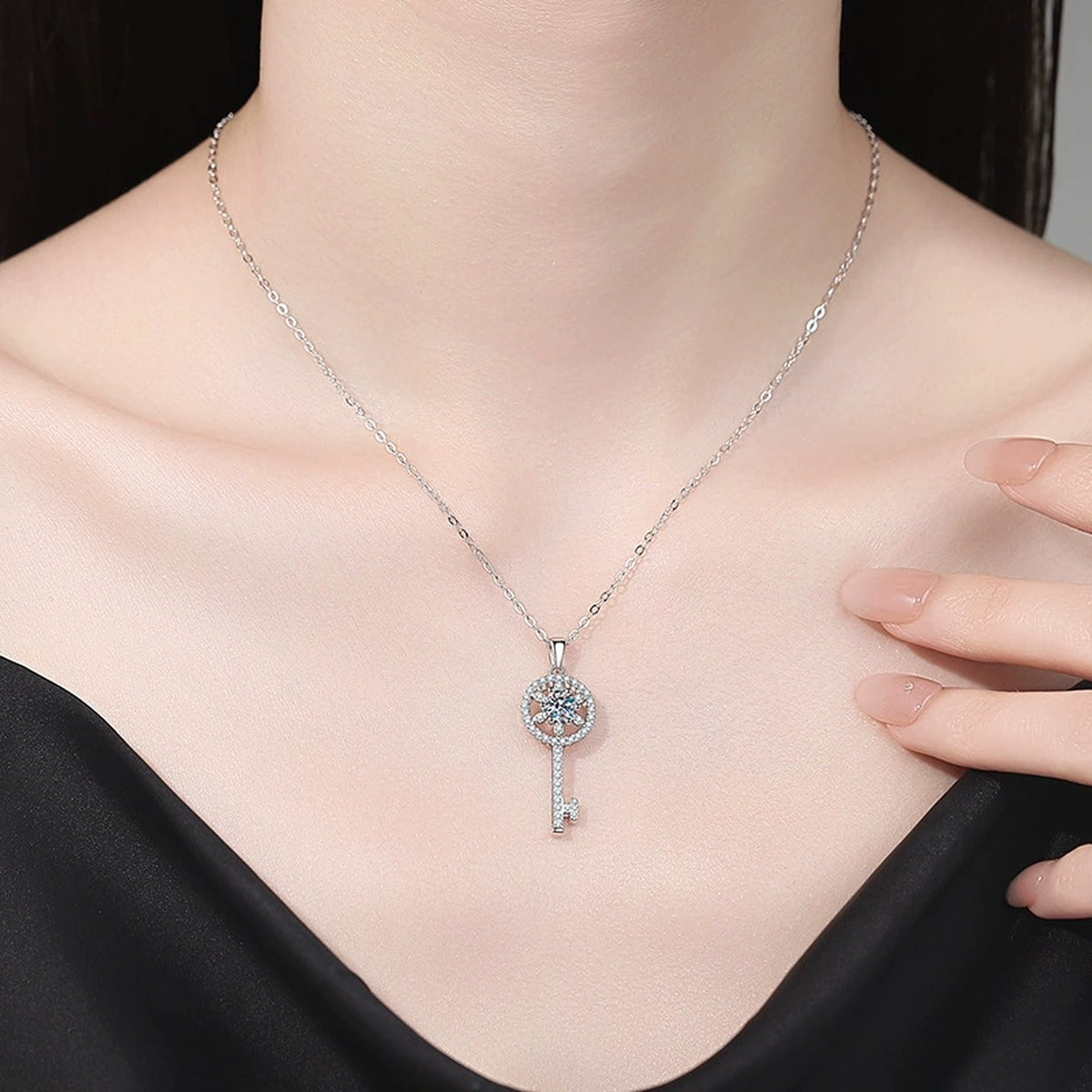 Round Key Moissanite Pendant Necklace with Cubic Zirconia in Platinum-Plated S925 Sterling Silver worn on neckline by model