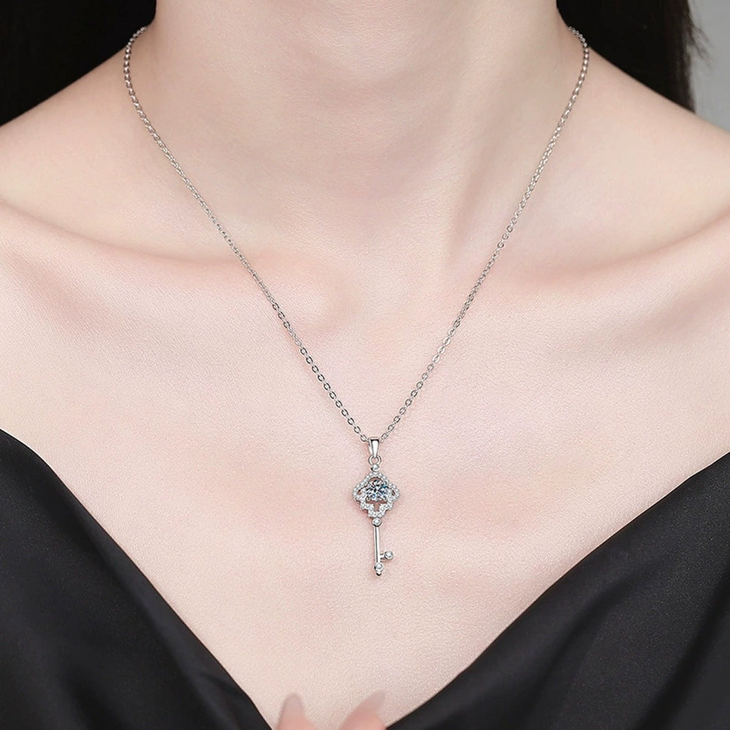 Cross Key Moissanite Pendant Necklace with Cubic Zirconia in Platinum-Plated S925 Sterling Silver worn on neckline by model