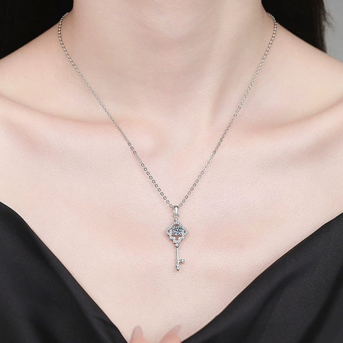 Cross Key Moissanite Pendant Necklace with Cubic Zirconia in Platinum-Plated S925 Sterling Silver worn on neckline by model