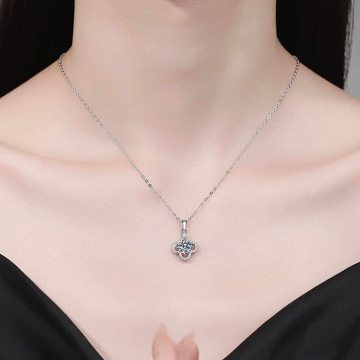 Clover Halo Moissanite Pendant Necklace with Cubic Zirconia in Platinum-Plated S925 Sterling Silver worn on neckline by model
