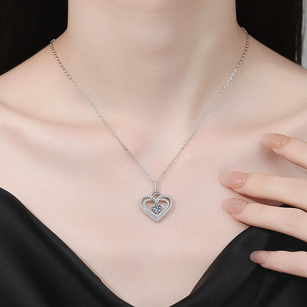 Heart Moissanite Pendant Necklace with Cubic Zirconia in White Gold-Plated S925 Sterling Silver worn on neckline by model
