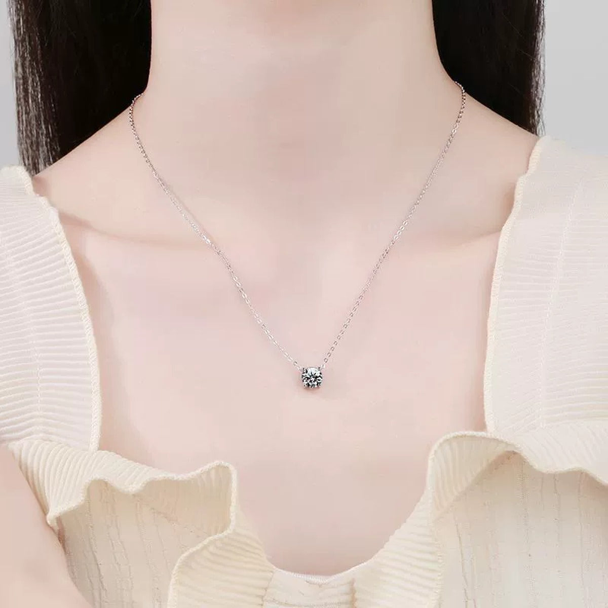 Round Moissanite Pendant Necklace in S925 Sterling Silver worn on neckline by model