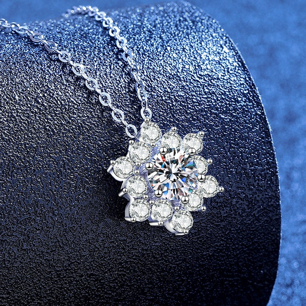 Starburst Moissanite Pendant Necklace with Cubic Zirconia in White Gold-Plated S925 Sterling Silver blue background angled view