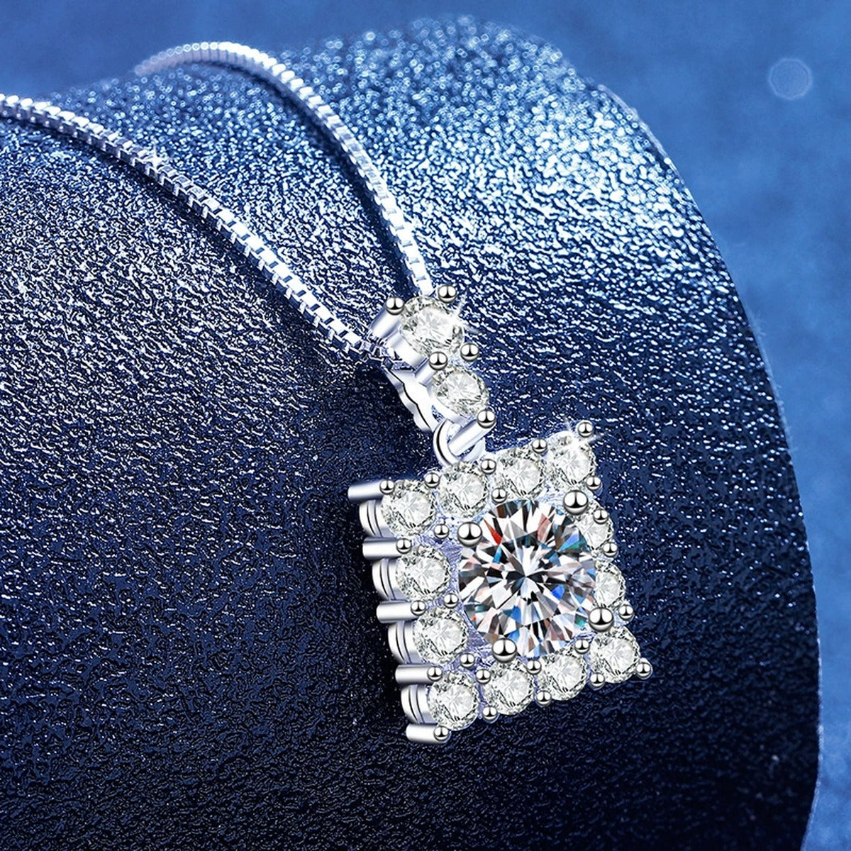 Square Moissanite Pendant Necklace with Cubic Zirconia in White Gold-Plated S925 Sterling Silver blue background angled view