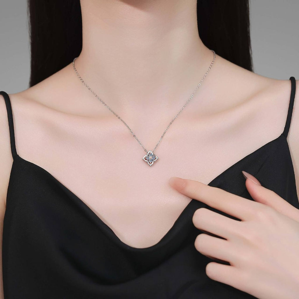 Round Moissanite Pendant Necklace in S925 Sterling Silver worn on neckline by model