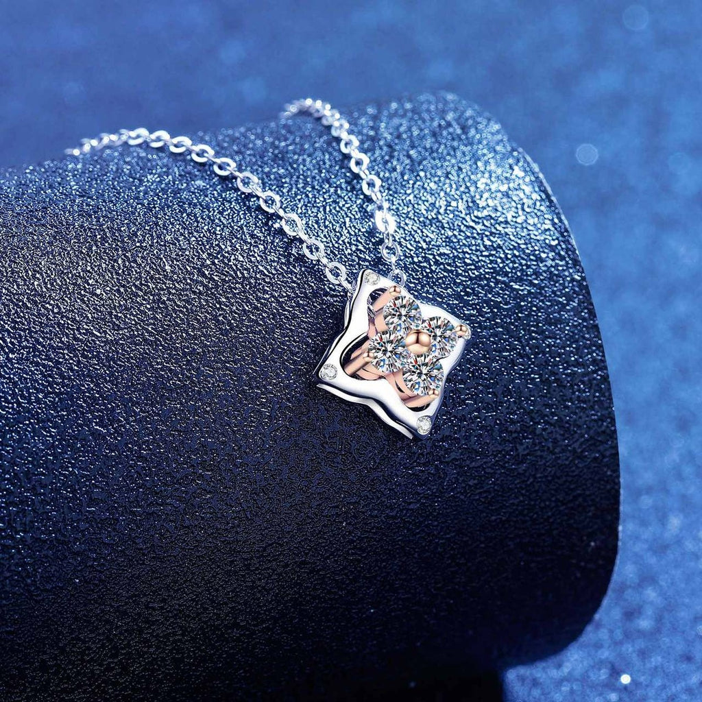 Round Moissanite Pendant Necklace in S925 Sterling Silver blue background close-up view