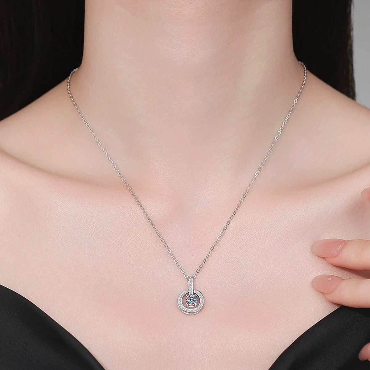 Round Moissanite Pendant Necklace with Cubic Zirconia in White Gold-Plated S925 Sterling Silver worn on neckline by model