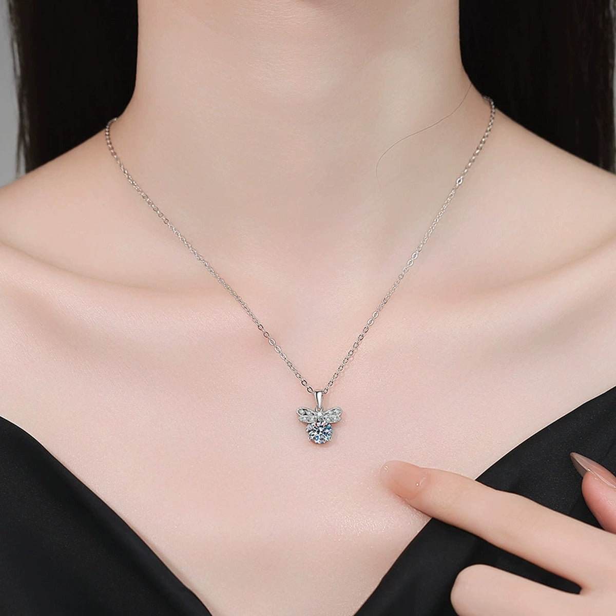 Round Moissanite Pendant Necklace with Cubic Zirconia in White Gold-Plated S925 Sterling Silver worn on neckline by model