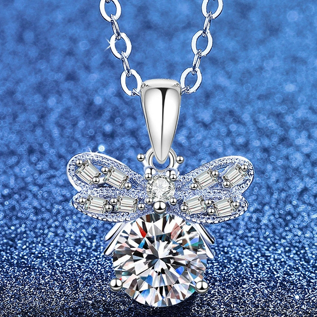 Round Moissanite Pendant Necklace with Cubic Zirconia in White Gold-Plated S925 Sterling Silver blue background angled view