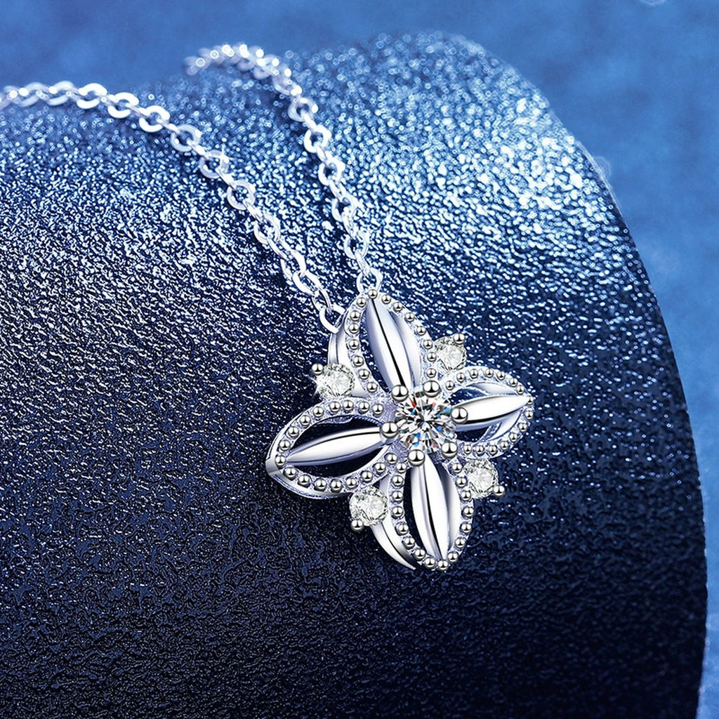 Petite Moissanite Pendant Necklace with Cubic Zirconia in White Gold-Plated S925 Sterling Silver blue background angled view
