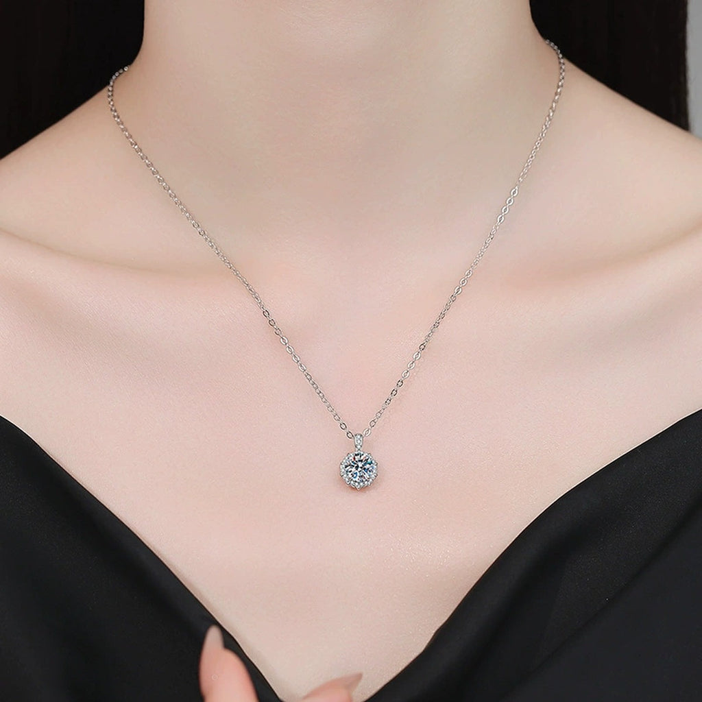 Round Moissanite Pendant Necklace with Cubic Zirconia in White Gold-Plated S925 Sterling Silver worn on neckline by model