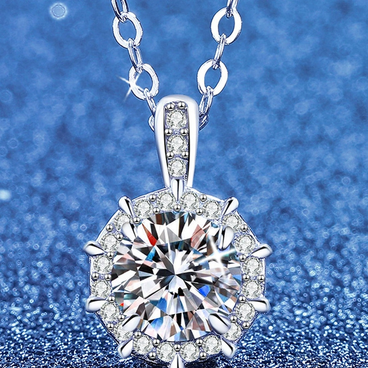 Round Moissanite Pendant Necklace with Cubic Zirconia in White Gold-Plated S925 Sterling Silver blue background angled view
