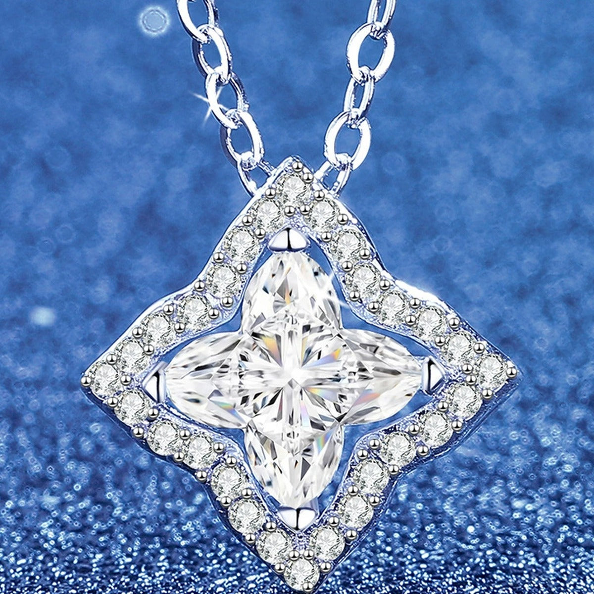 Diamond-Shaped Moissanite Pendant Necklace with Cubic Zirconia in White Gold-Plated S925 Sterling Silver blue background angled view