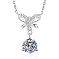 Platinum-plated S925 sterling silver bow round moissanite pendant necklace on white background
