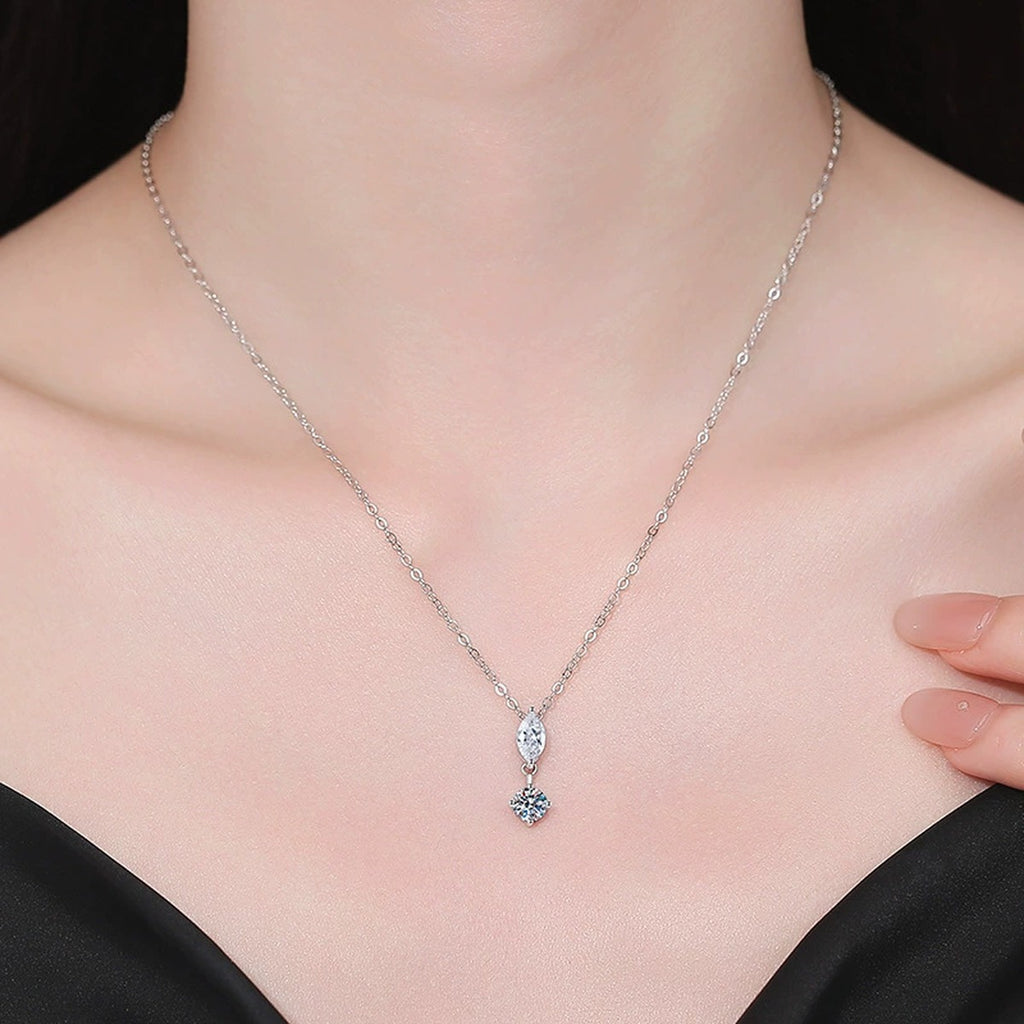 Model wearing a platinum-plated S925 sterling silver marquise and round moissanite pendant necklace