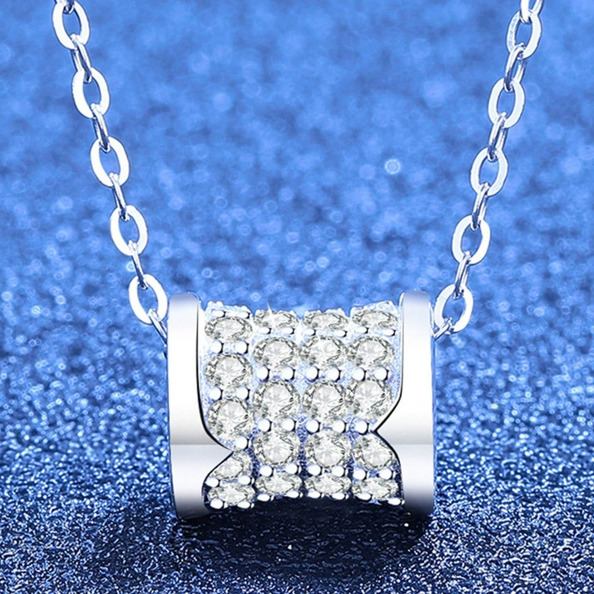 Round Moissanite Pendant Necklace in White Gold-Plated S925 Sterling Silver blue background angled view