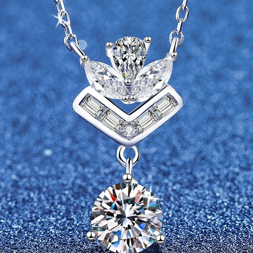 Chevron Moissanite Pendant Necklace with Cubic Zirconia in White Gold-Plated S925 Sterling Silver blue background angled view