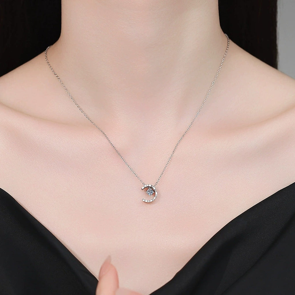 Petite Moissanite Pendant Necklace in White Gold-Plated S925 Sterling Silver worn on neckline by model