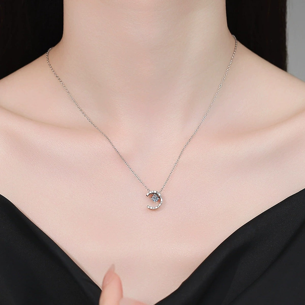 Petite Moissanite Pendant Necklace in White Gold-Plated S925 Sterling Silver worn on neckline by model