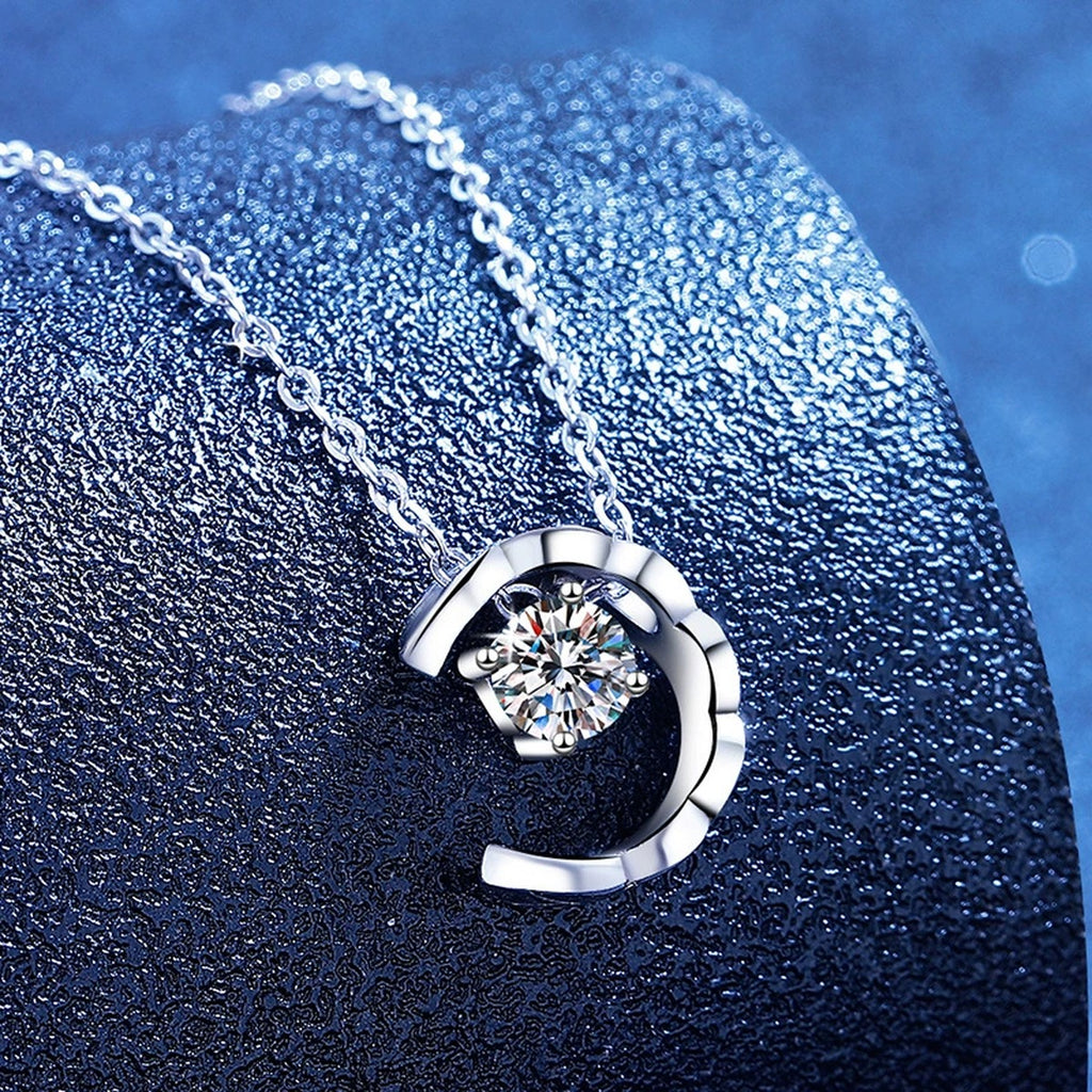 Petite Moissanite Pendant Necklace in White Gold-Plated S925 Sterling Silver blue background angled view