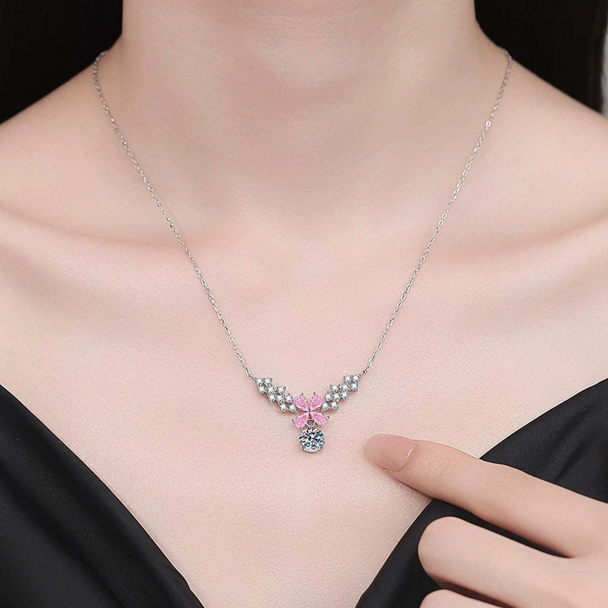 Pink Moissanite Pendant Necklace with Cubic Zirconia in White Gold-Plated S925 Sterling Silver worn on neckline by model