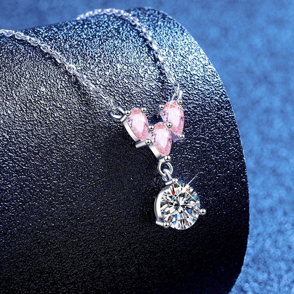 Pink Moissanite Pendant Necklace with Cubic Zirconia in White Gold-Plated S925 Sterling Silver blue background angled view
