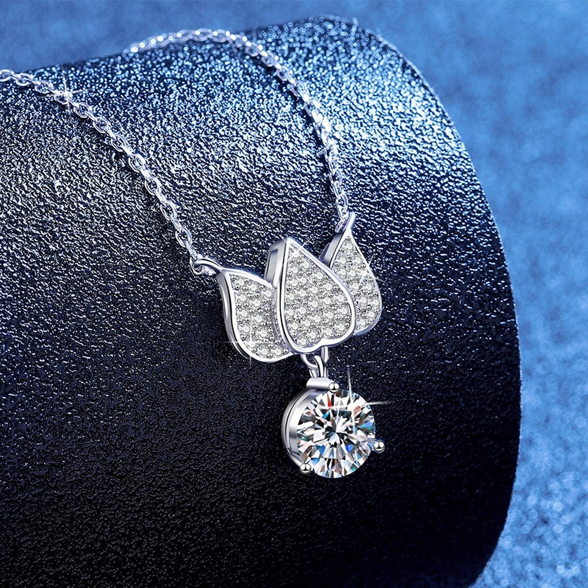 Butterfly Moissanite Pendant Necklace with Cubic Zirconia in White Gold-Plated S925 Sterling Silver blue background angled view