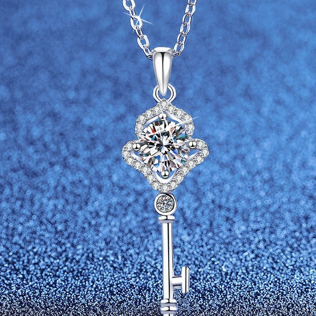 Key Moissanite Pendant Necklace with Cubic Zirconia in White Gold-Plated S925 Sterling Silver blue background angled view