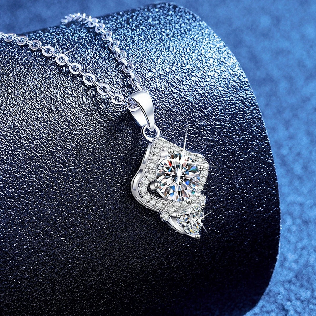 Rhombus Moissanite Pendant Necklace with Cubic Zirconia in White Gold-Plated S925 Sterling Silver blue background angled view