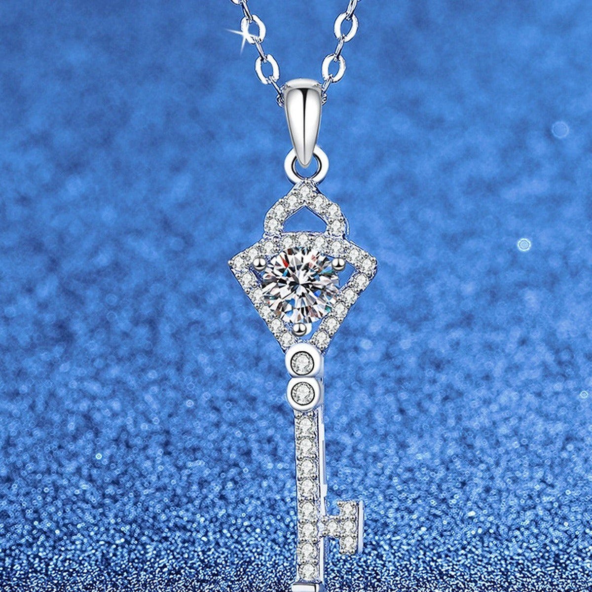 Round Moissanite Pendant Necklace with Cubic Zirconia in White Gold-Plated S925 Sterling Silver blue background angled view