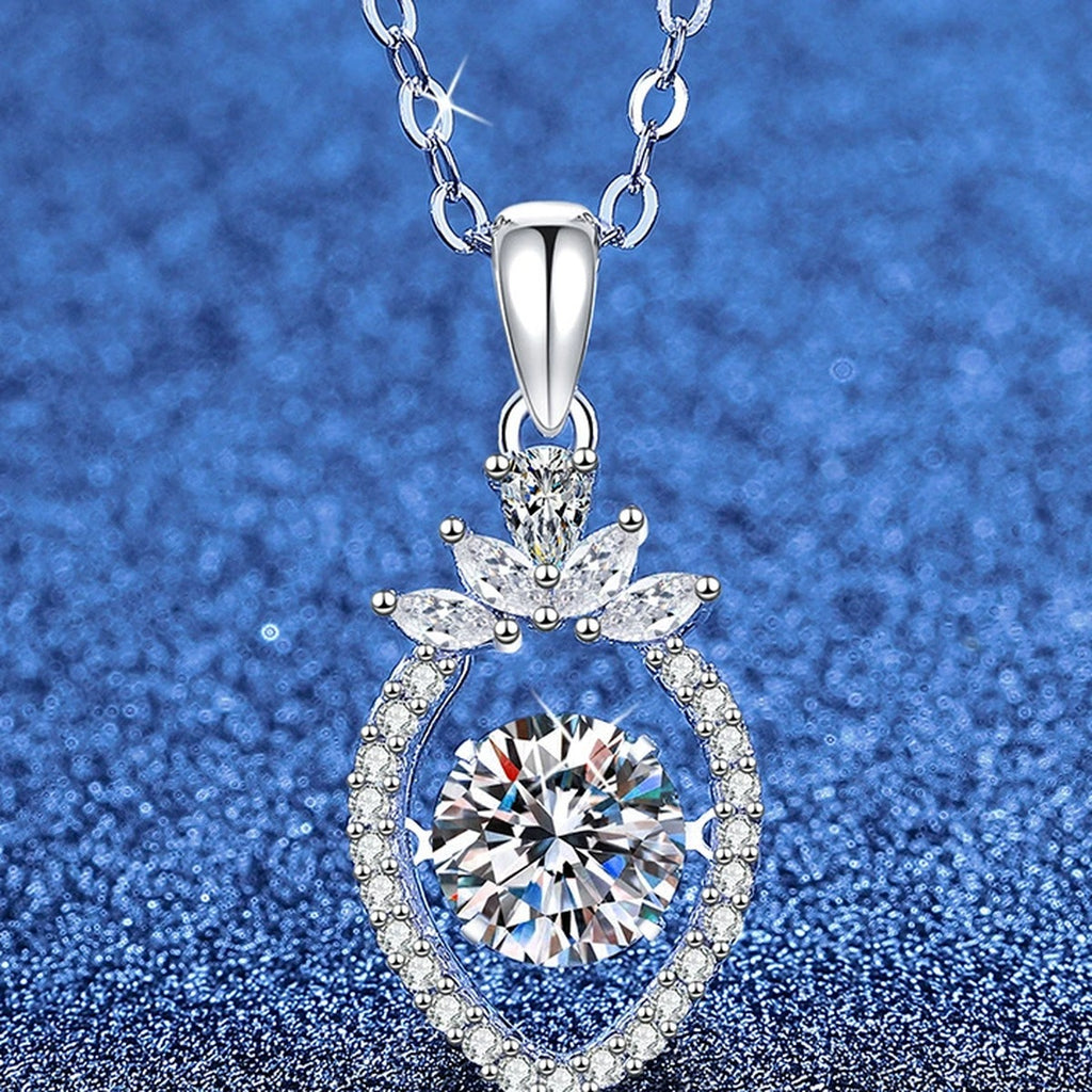 Round Moissanite Pendant Necklace with Cubic Zirconia in White Gold-Plated S925 Sterling Silver blue background angled view