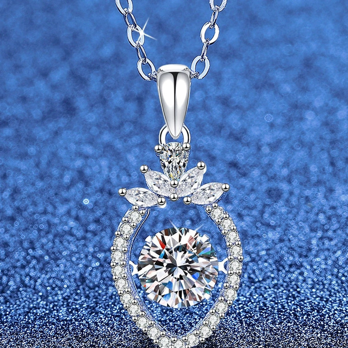 Round Moissanite Pendant Necklace with Cubic Zirconia in White Gold-Plated S925 Sterling Silver blue background angled view
