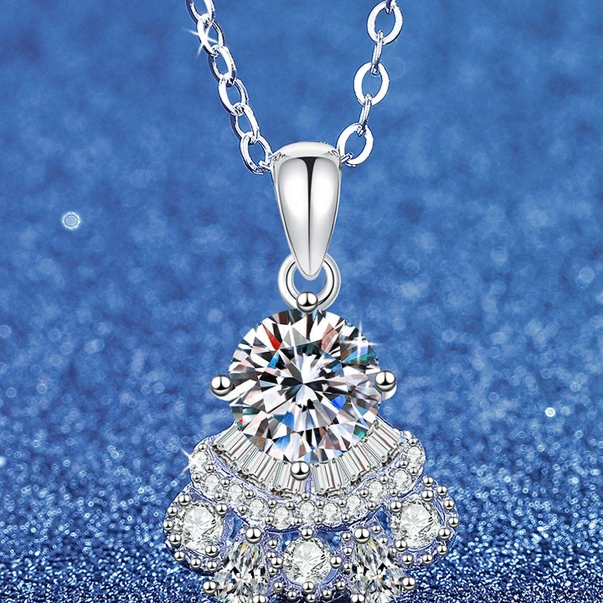 Round Moissanite Pendant Necklace with Cubic Zirconia in White Gold-Plated S925 Sterling Silver blue background angled view