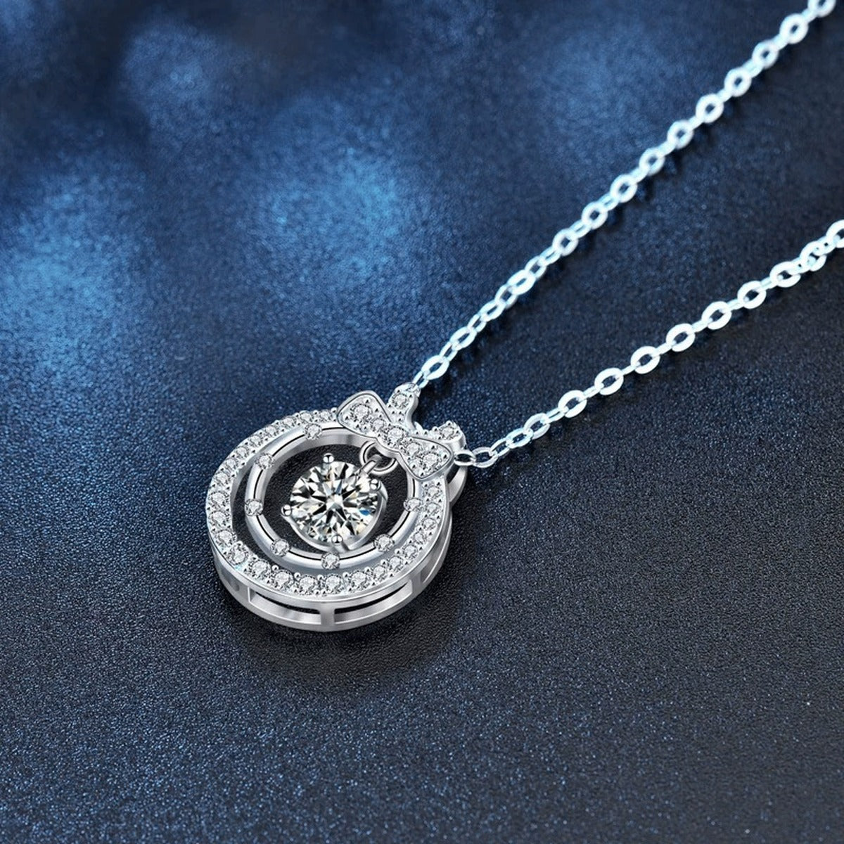 Bow Round Moissanite Necklace with CZ in White Gold-Plated S925 sterling silver blue display scene showing chain and stone layout