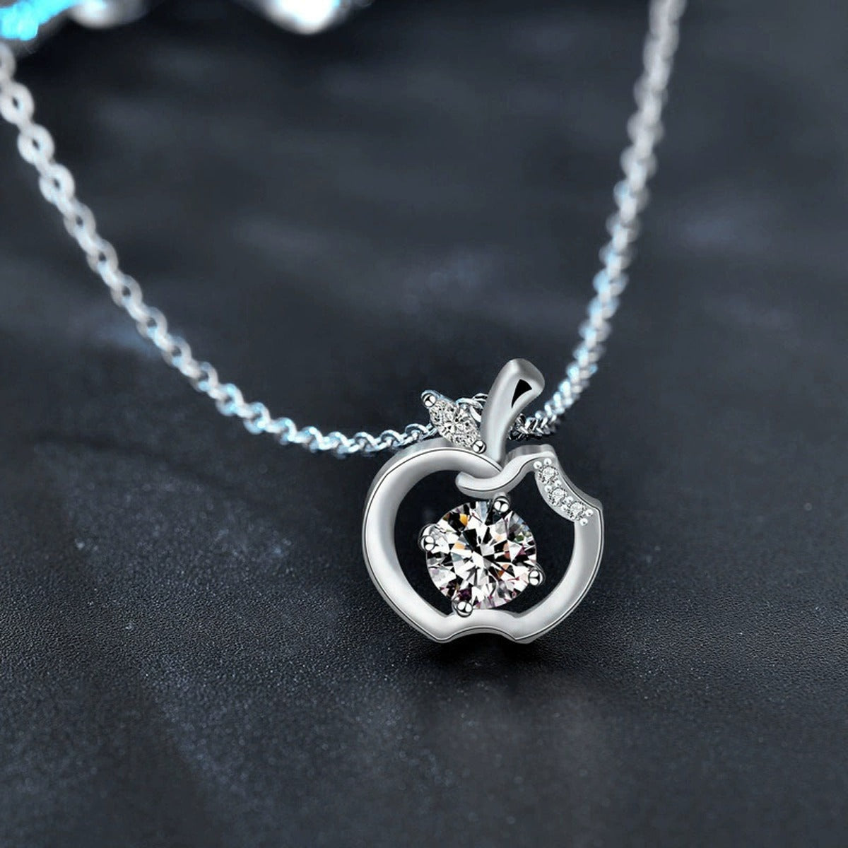 Apple Round Moissanite Necklace with CZ in White Gold-Plated S925 sterling silver blue display scene showing chain and stone layout